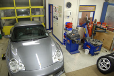 Porsche 996 in seal grey inside the TWR workshop
